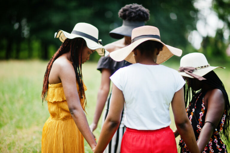 Group of four gorgeous african american womans wear summer hat h