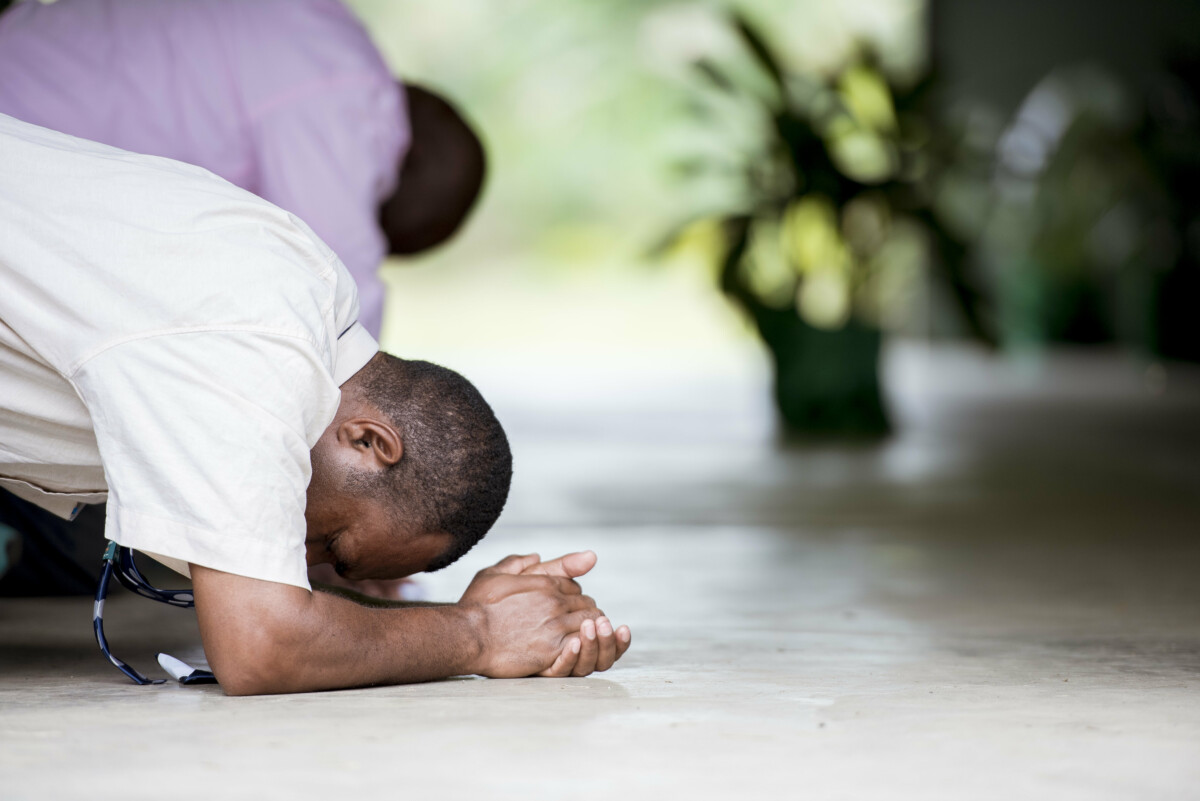Shallow focus shot male praying